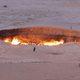 A jeep and visitors seen at the Gateway to Hell, a huge burning gas crater in the heart of Turkmenistan's Karakum Desert.